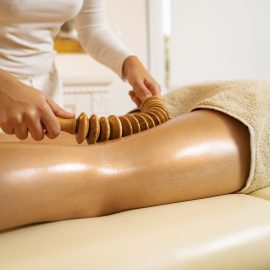Wooden roller for anti cellulite massaging